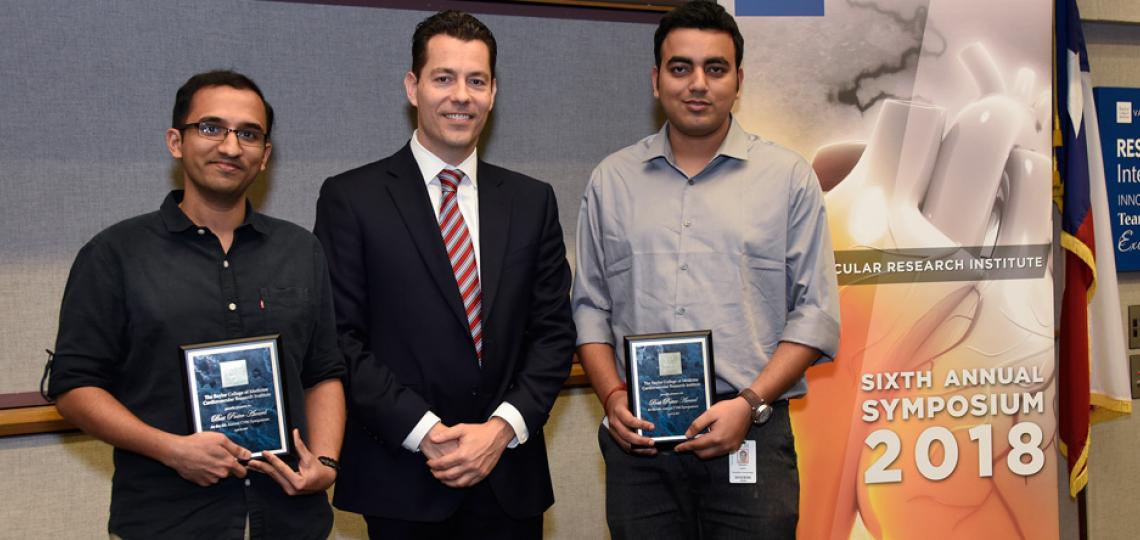 Winners of the Best Poster from the CVRI 2018 Symposium pose for a photo. From left: Ashish Rao, CVRI Director Xander Wehrens and Satadru Lahiri. Not pictured: Khurrum Khan and Parag Jain