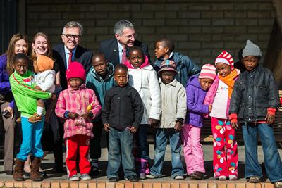 Dr. Paul Klotman talks with children as he tours the Baylor-Bristol-Myers Squibb Children's Clinical Center of Excellence in Maseru. Photo by Smiley N. Pool.